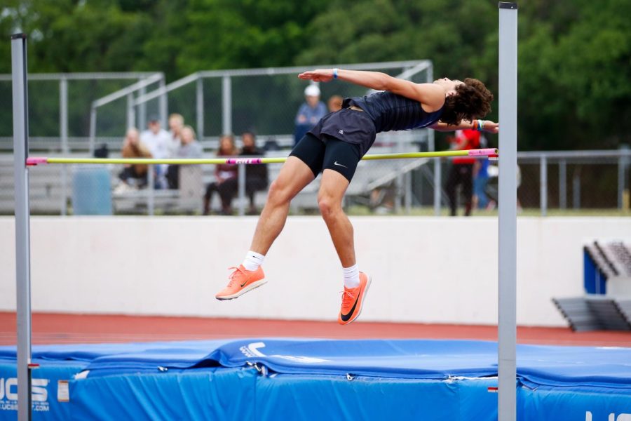 Sophomore Colston Adamson high jumps. Adamson jumped a height of 62. 