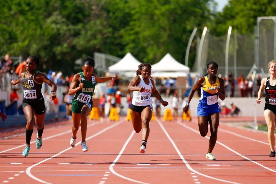 Junior Leila Ngapout runs in the 100 meter dash finals. Ngapout placed third, running the race in 11.96 seconds. 