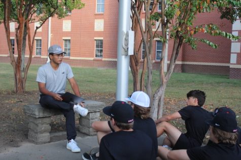Junior FCA leader Lorenzo Osteguin preaches values of God at the flagpole. See You at the Pole is an annual national event.  