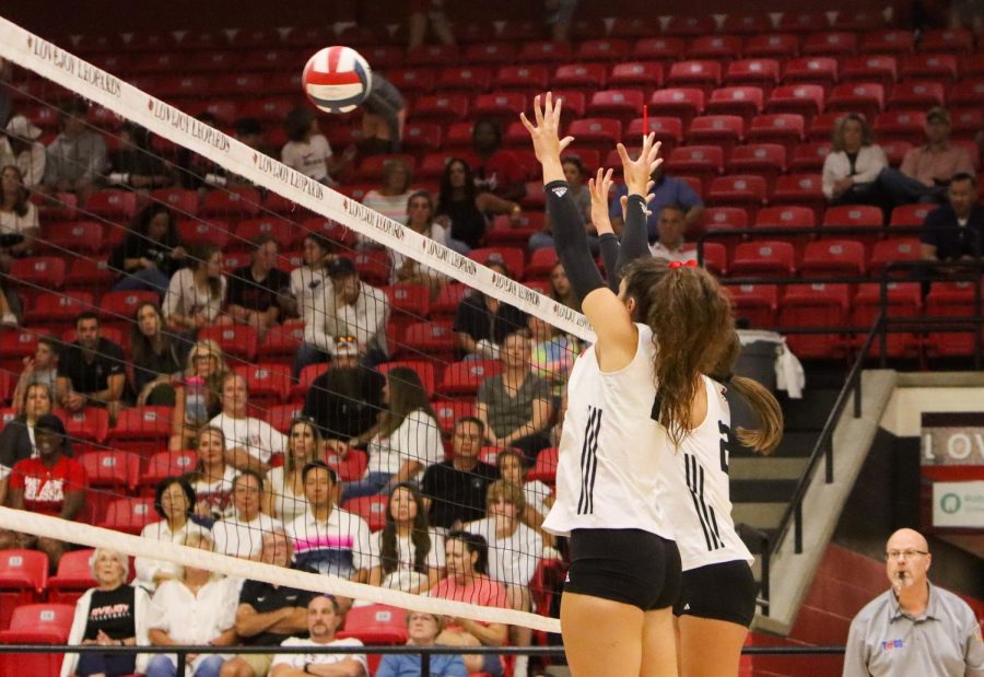 Junior no.22 Bethany wu and senior no.12 Hannah Gonzalez jumps up for a block. The Leopards won the third set 25-17.