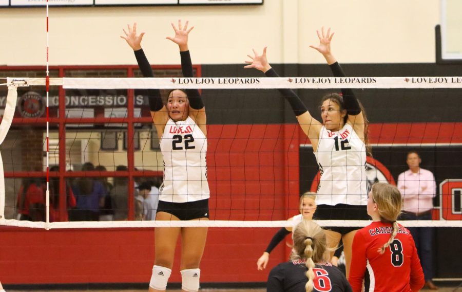 Junior no.22 Bethany Wu and senior no.12 Hannah Gonzalez jump up for a block. The Leopards won the second set 25-13.