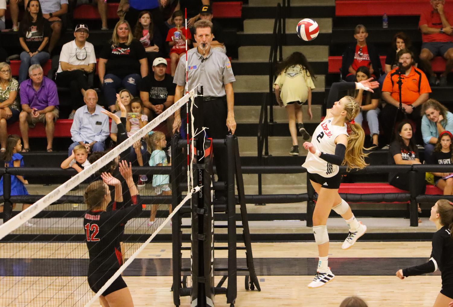Sophomore no.2 Shelby Burriss jumps up for a spike. The Leopards had a total of 47 kills throughout the game against Melissa.