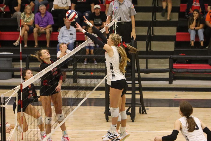 Sophomore no.2 Shelby Burriss jumps up at the net for a block. Burriss had seven kills during Fridays game.