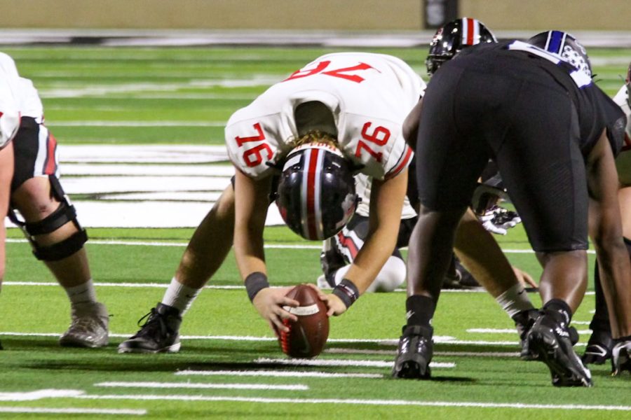 Senior long snapper no. 76 Will Frost snaps the ball. The Leopards scored a total of 6 points off of field goals.  