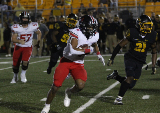 Junior running back no. 4 Dante Dean carries the ball. This past Friday, Lovejoy played against Denison high school.