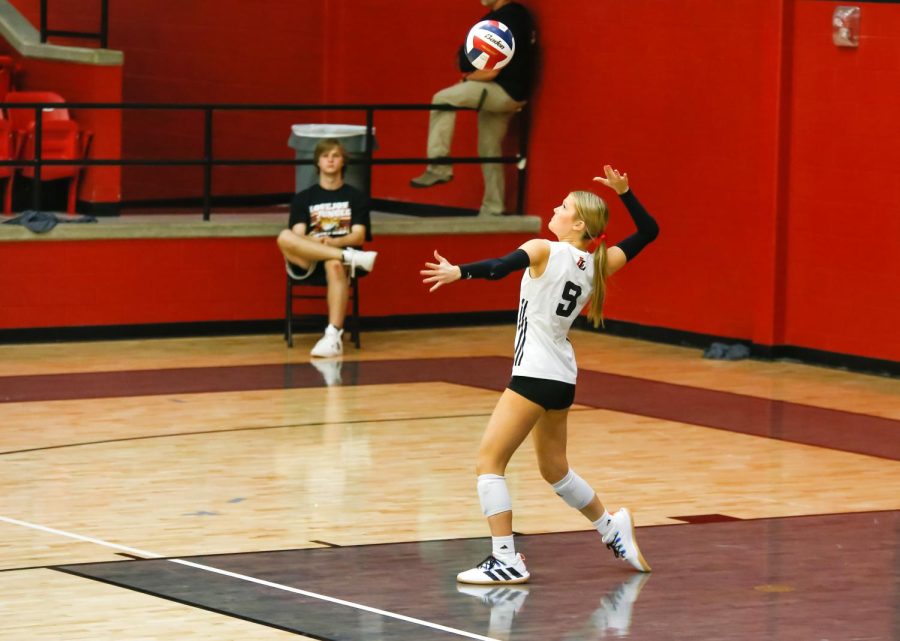 Junior no.9 Kalin Carlson serves the ball. The Leopards won in straight sets 3-0.