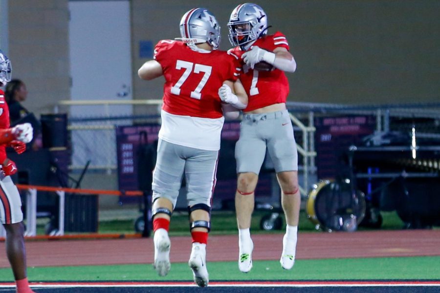 Junior running back no. 7 Matthew Mainord and Sophomore tackle no. 77 Tegan Braithwaite shoulder bump after a touchdown. Mainord rushed for 162 yards, and he has four touchdowns throughout the game.