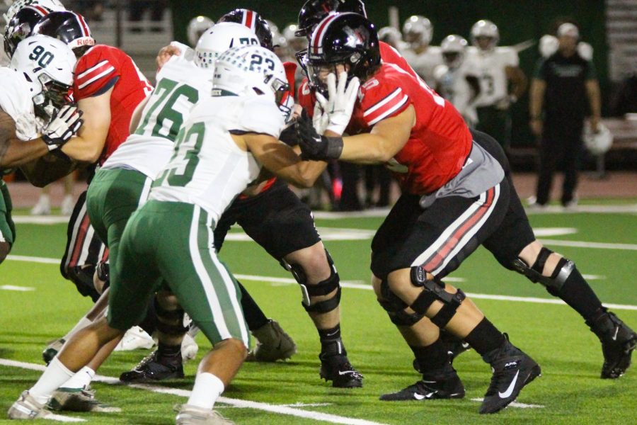 Senior tackle no. 75 Noah Gardner blocks Poteets player. The team won the game with a final score of 70-3.