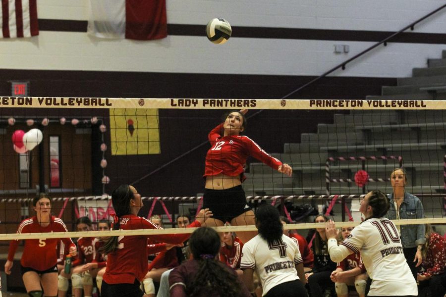 Senior no. 12 Hannah Gonzalez and jumps out for a spike. The leopards won in straight sets.