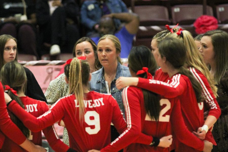 Head coach Natalie Puckett addresses the team after a timeout. The leopards are advancing to the regional quarterfinals against Forney on Tuesday.