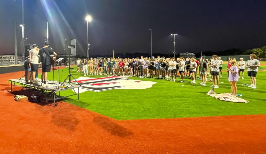FCA sings worship at fields of faith. Over 200 people came to the event.  