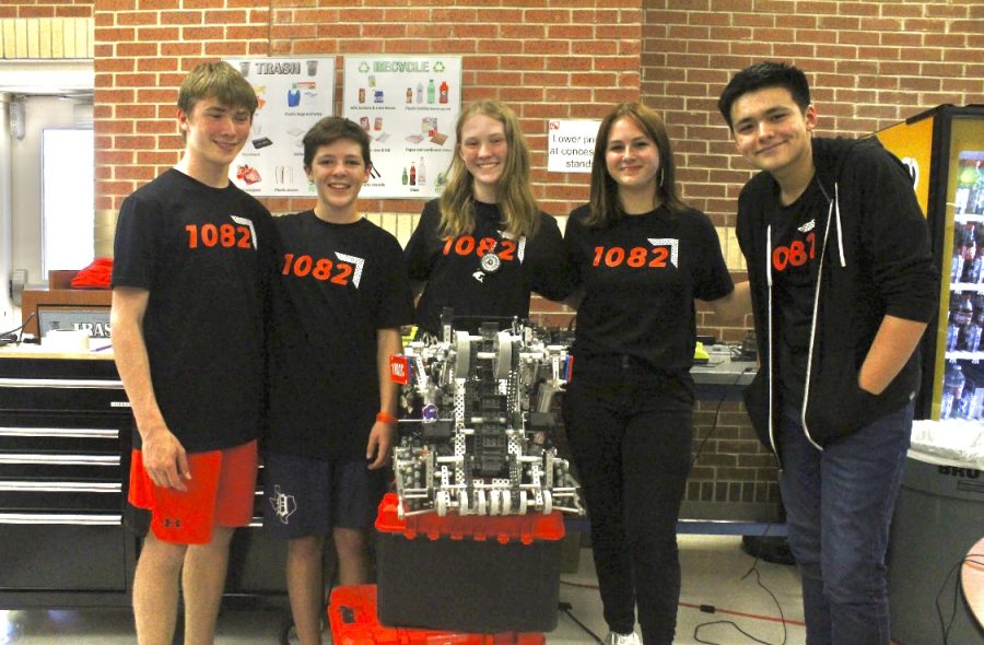 Team 1082C stands in front of their bot. The team was ranked first in the qualification rounds with a match record of 6-0-0.
