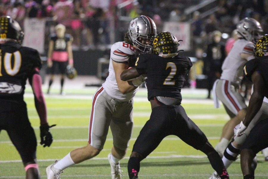 Junior tight end no. 86 Ridge Barker blocks the Crandall defense. Ridge also is on the track and field team.