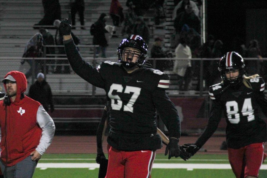 Senior offensive tackle no. 67 Steve Kapp celebrates the win. The team is moving on to the second round of the playoffs.