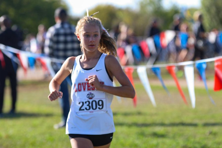 Freshman Camryn Benson runs at the State meet.  Benson placed fourth for the team and tenth overall.