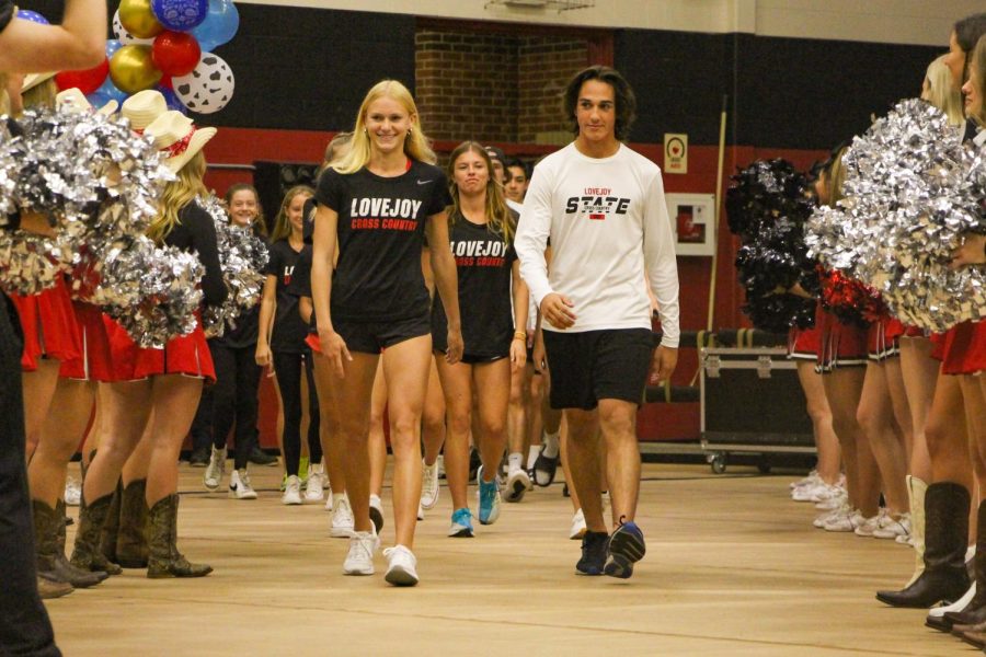 Juniors Kailey Littlefield and Nick 
Yarad walk into the western pep rally. The team was being recognized for going to State the following Saturday.
