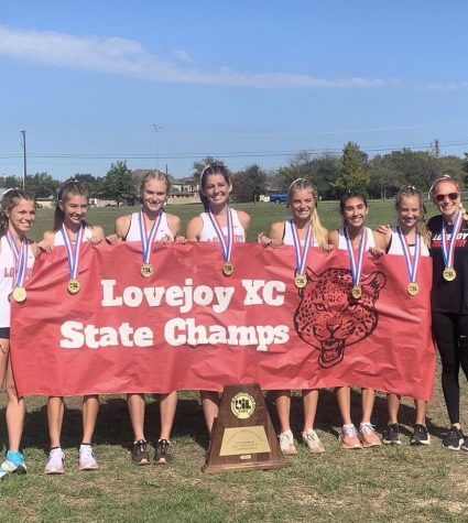 The girls team poses for a picture after winning the state championship. The girls finished first and the boys team finished in second place.