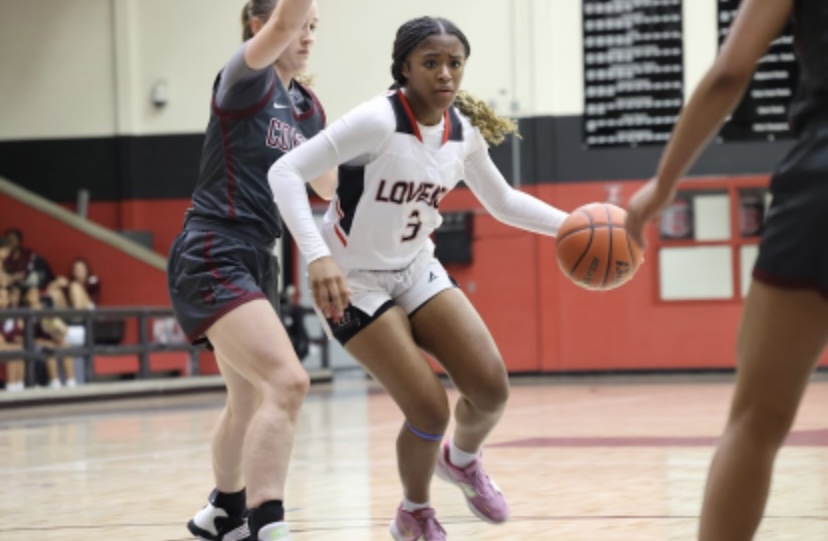 Sophomore guard Sidney Carr drives to the hoop. The girls basketball team is currently 1-3 on the season.