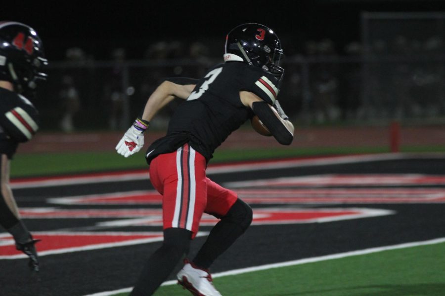 Junior wide receiver no. 3 Parker Livingstone intercepts the ball. The final score of the game was 38-34.