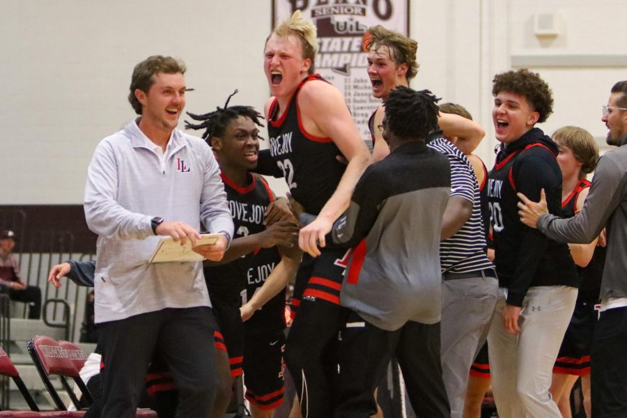 Senior center no.12 celebrates after a shot. The leopards are 12-2 in district.