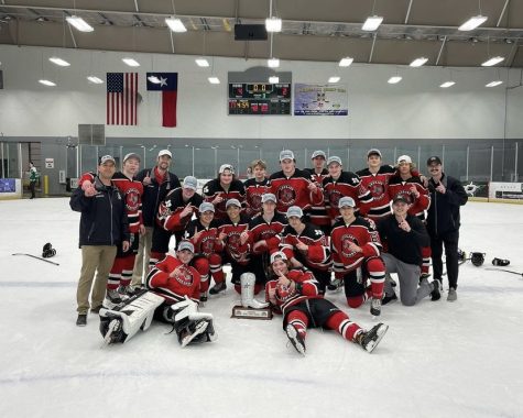 The hockey team poses for a picture after their game. The team won the Best in the West tournament this past weekend.