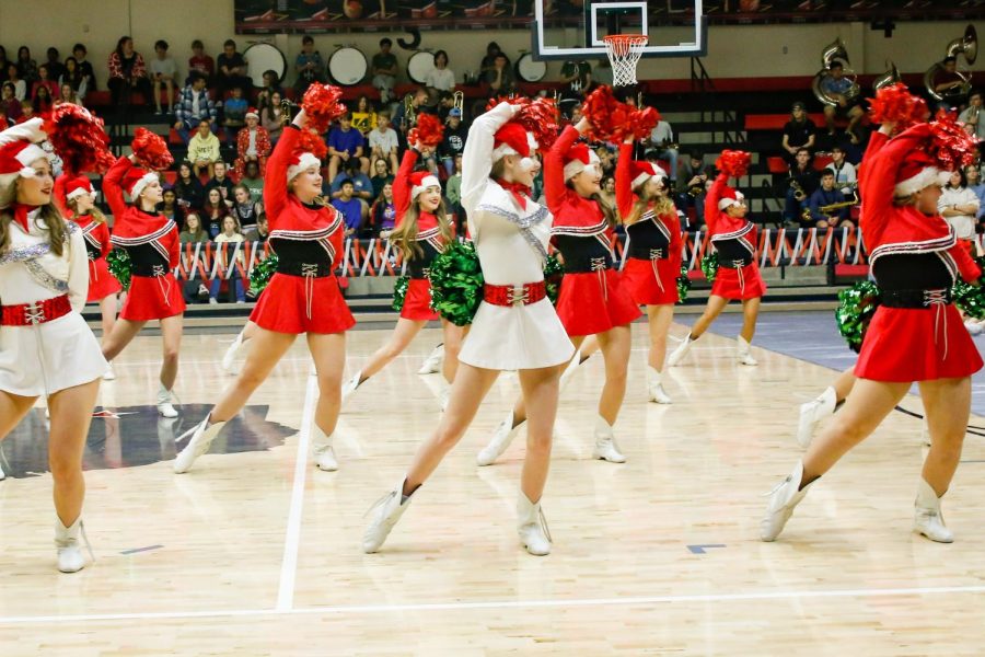 The Majestics Dance team poses during their Christmas routine. the Majestic would perform at halftime for football games.