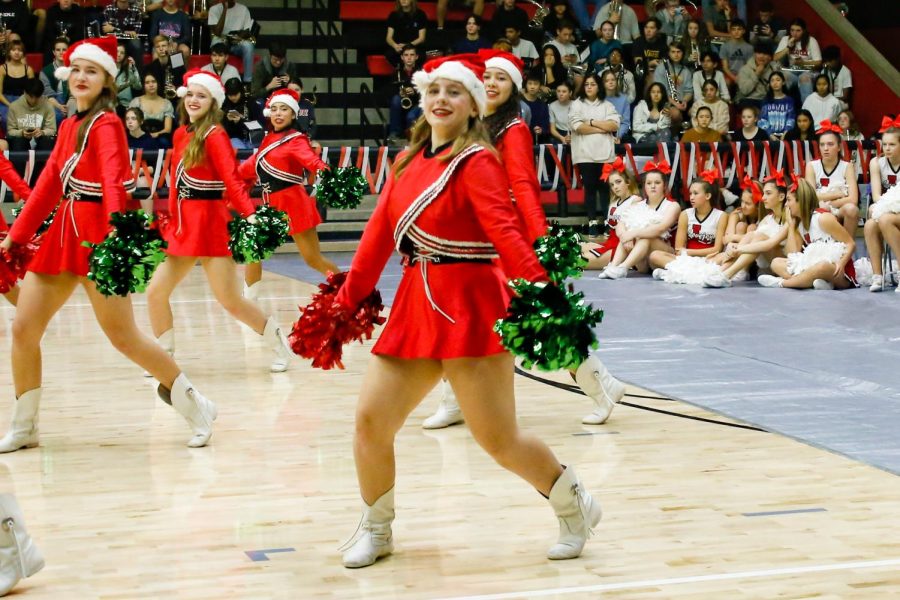 Junior Grace Johnson dances at the pep rally. The Majestics performed at the academic pep rally.