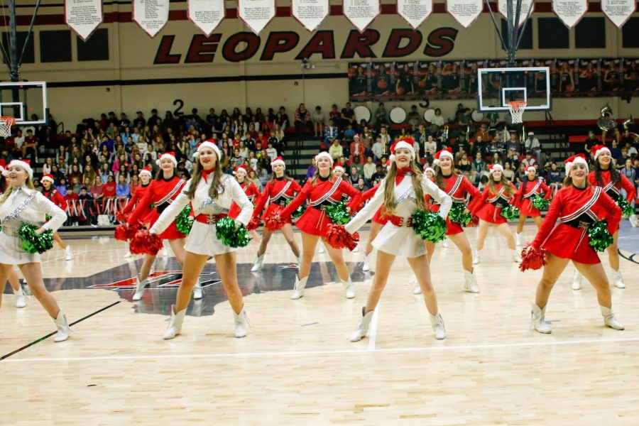 The Majestics Dance team performs at the academic pep rally. The gym was decorated for christmas.