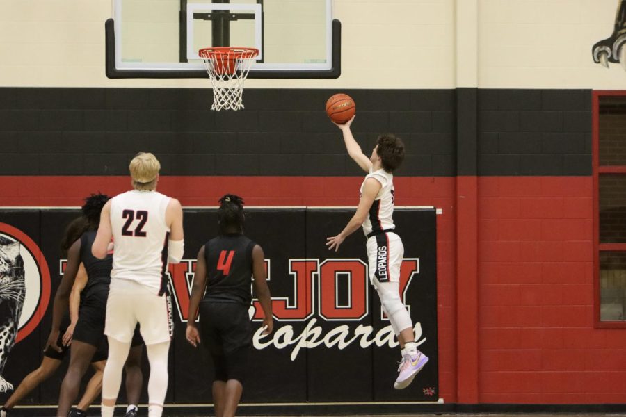 Senior no. 5 Wilma McLaughlin Jumps up for a lay up. The leopards are 6-0 in district.
