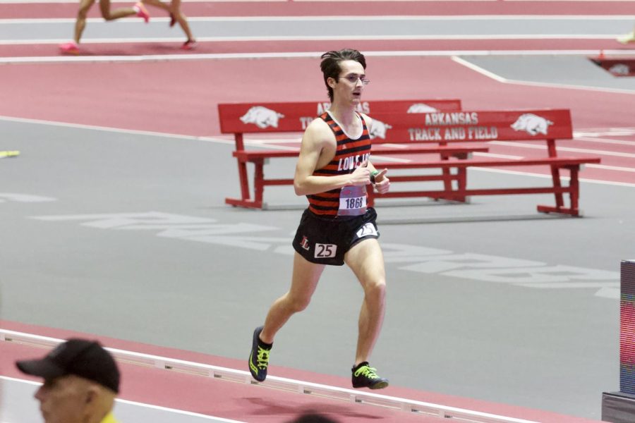 Senior Logan Peterson runs the 3k race at the Arkansas High School Invitational meet. peterson ran a time of 10:06.42.