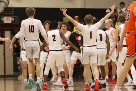 The leopard boys basketball team celebrates a victory. The teams current record is 23-5.