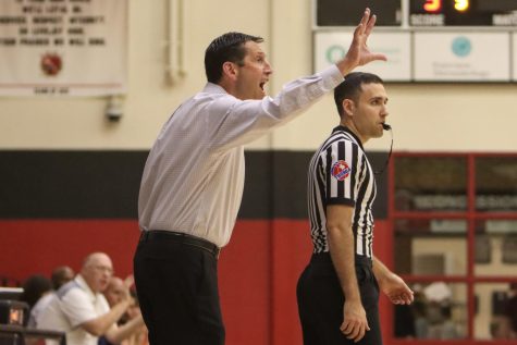 Boys basketball coach Kyle Herrema calls out a play to his team. The leopards ended their season on Monday night in a first round playoff loss to Crandall.