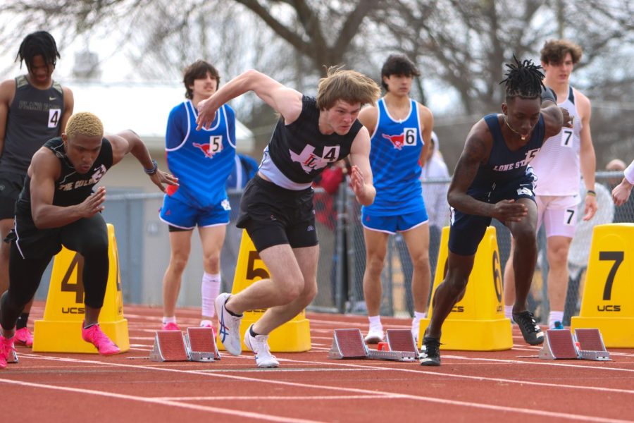 Senior Dawlton Burner comes out of the blocks in the open 100. Bruner PR'd with a time of 11:82.