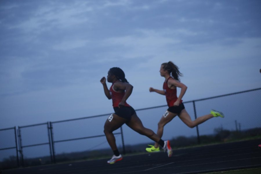 Seniors Leila Ngapout and Amy Morefield run the 400 meter dash. Morefield and Ngapout got first and second.