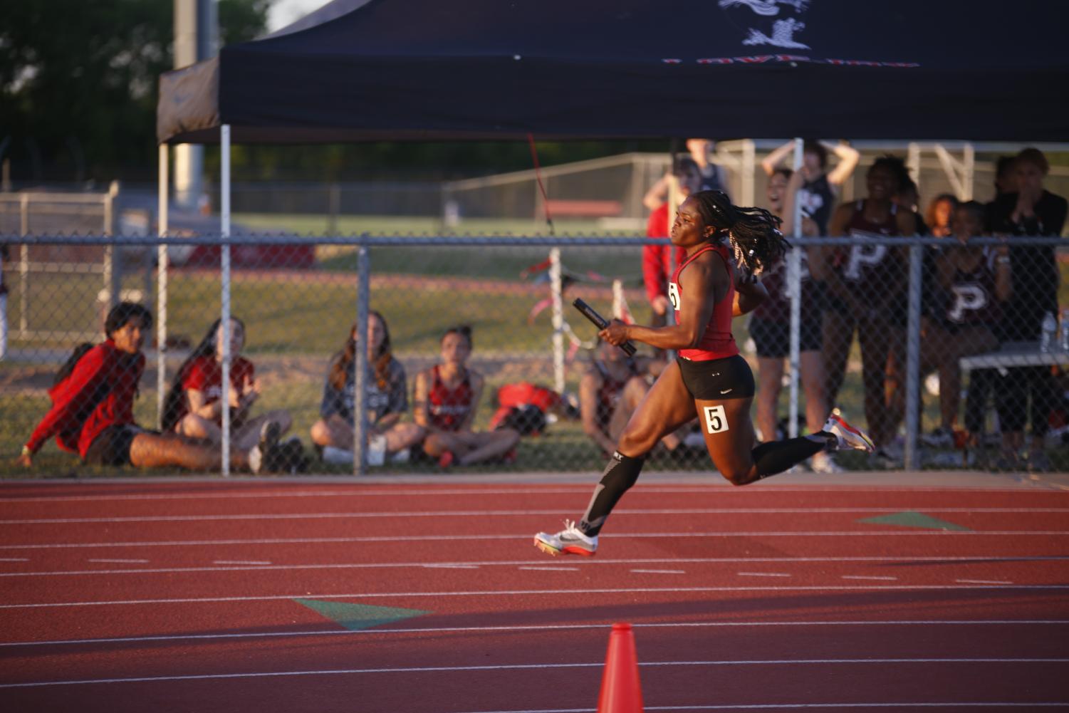 Senior Leila Ngapout runs the Girls Varsity 4x200m race. The girls got third with a time of 1:43.33.