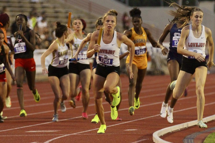 Senior Amy Morefield takes the baton from sophomore Mia Reaugh. Morefield also ran the 3200 at state.
