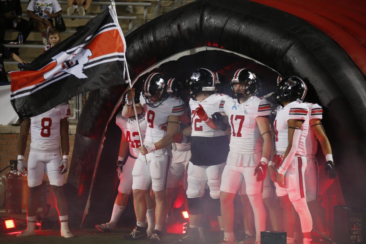 The team prepares to run out of the tunnel after halftime. The tunnel run was led by senior defensive lineman no. 9 Mason Dragoo.