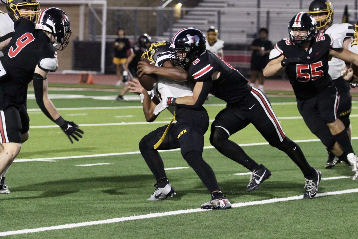 Senior line backer no. 6 Chase Bogle tackles Denisons player. The team has a 4-1 overall record.