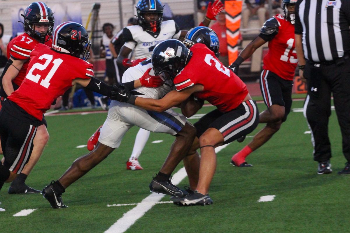 Junior safety no.2 RJ McIntosh stops North Crowleys player. The team will face Terrell on Friday.