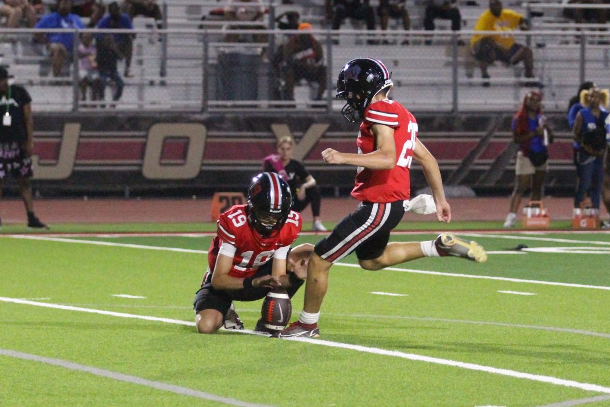 Sophomore kicker no. 25 Cooper Ryan kicks an extra point. The attempt was successful. 