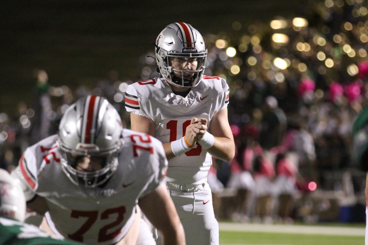Senior quarterback no. 10 Alexander Franklin claps to call for the ball. Franklin attempted to run the ball into the endzone.