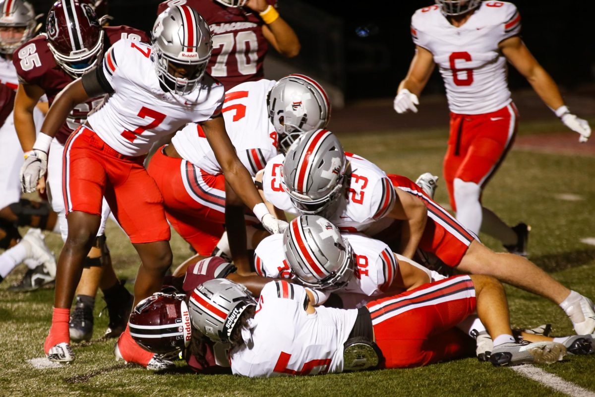 The Lovejoy defense tackles a Princeton player. Lovejoy had two games over fall break.