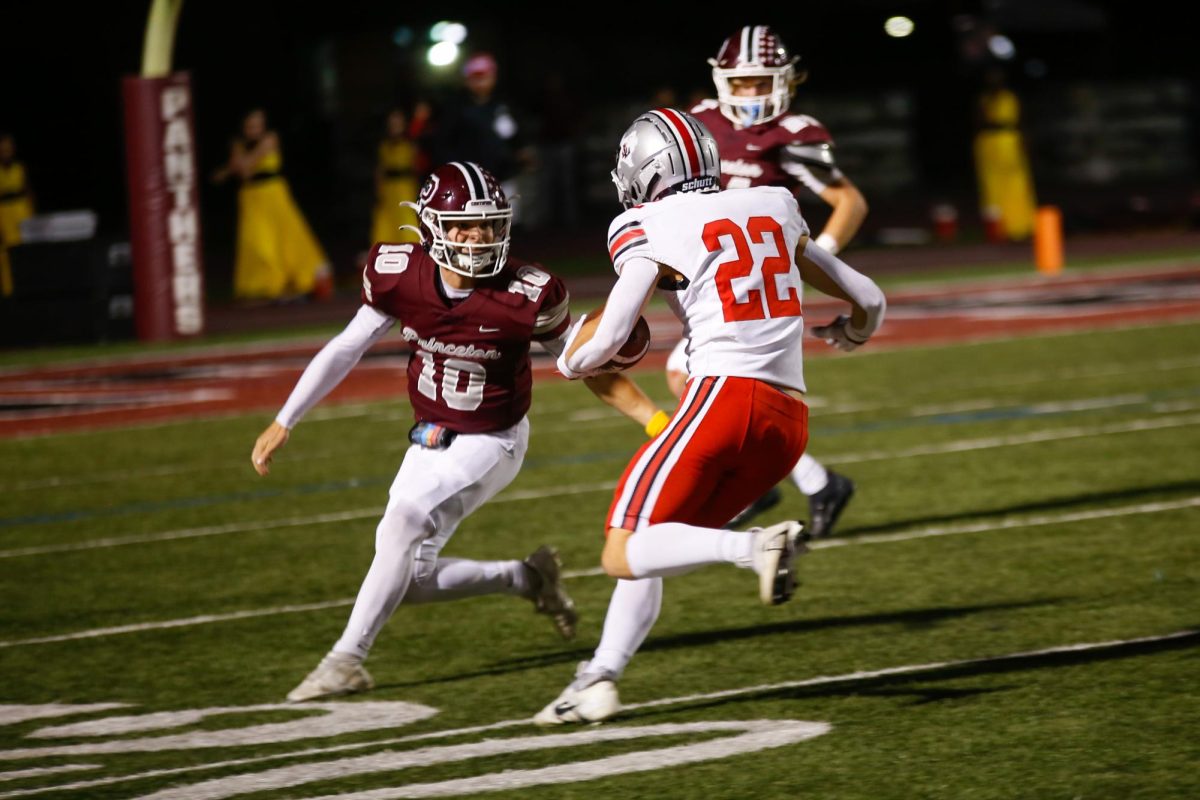Senior safety no. 22 Joseph Modine runs the ball. Modine intercepted the pass from the Princeton offense.