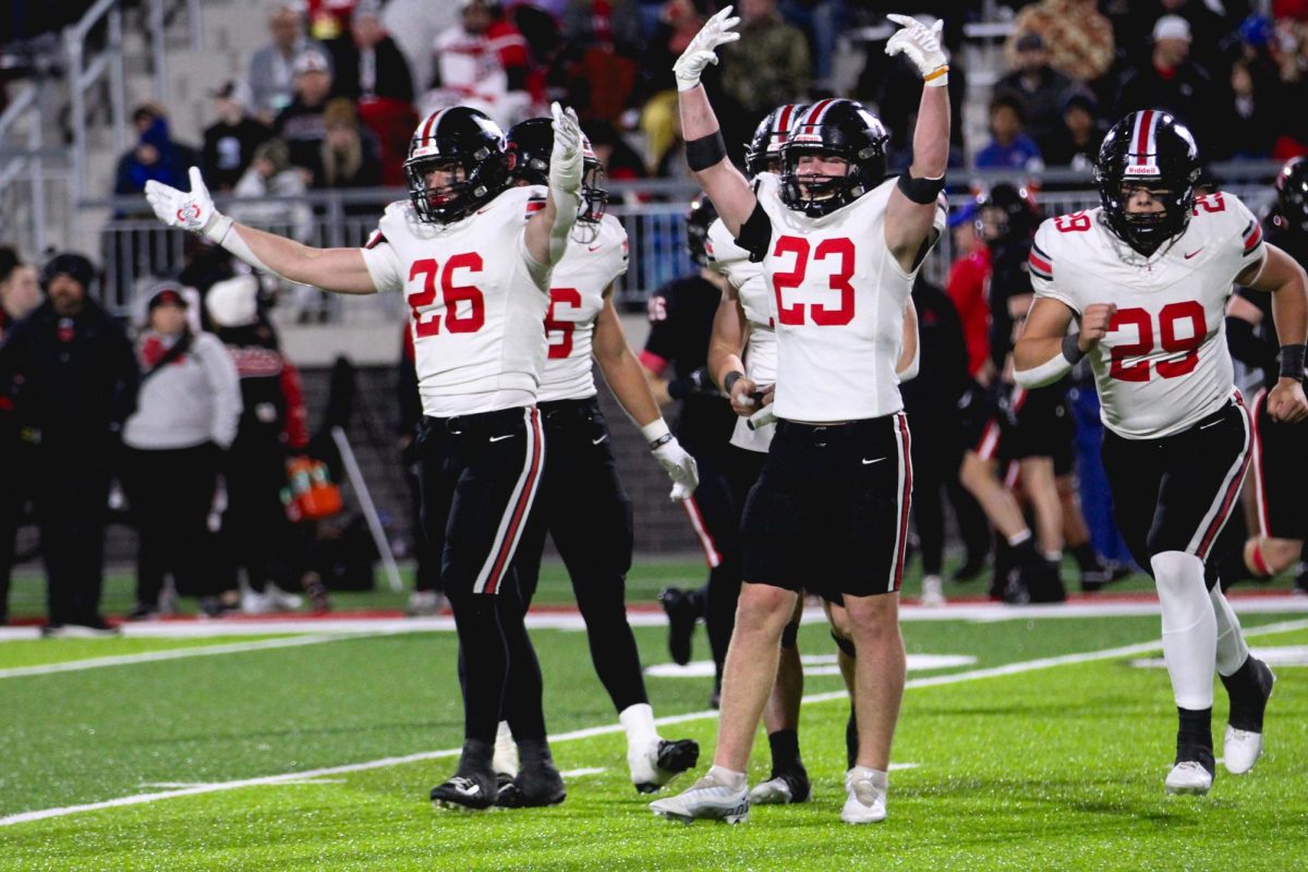 Senior line backer no. 26 Payton Pierce and junior line backer no. 23 Owen Magee hype up the crowd after a play. The Lovejoy defense only allowed one touchdown by Melissa. 