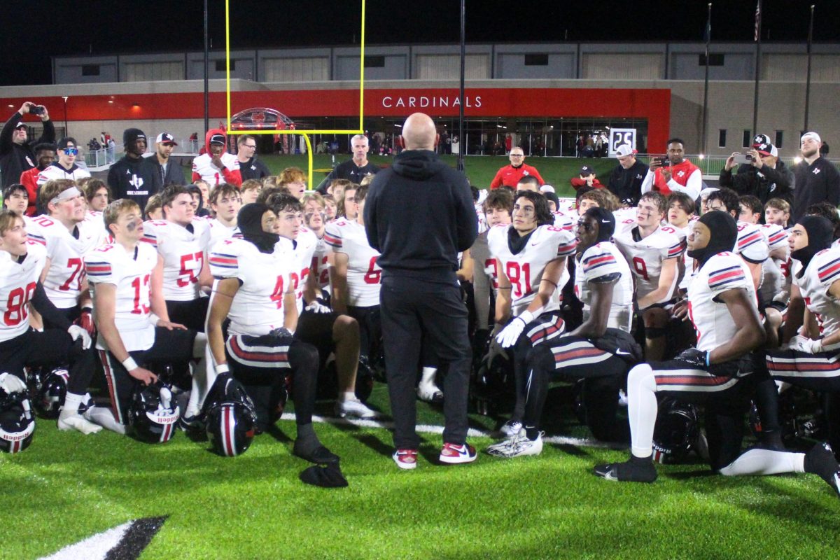 Head Coach Chris Ross talks to the team after the win against Melissa. The team was titled District Champions.  