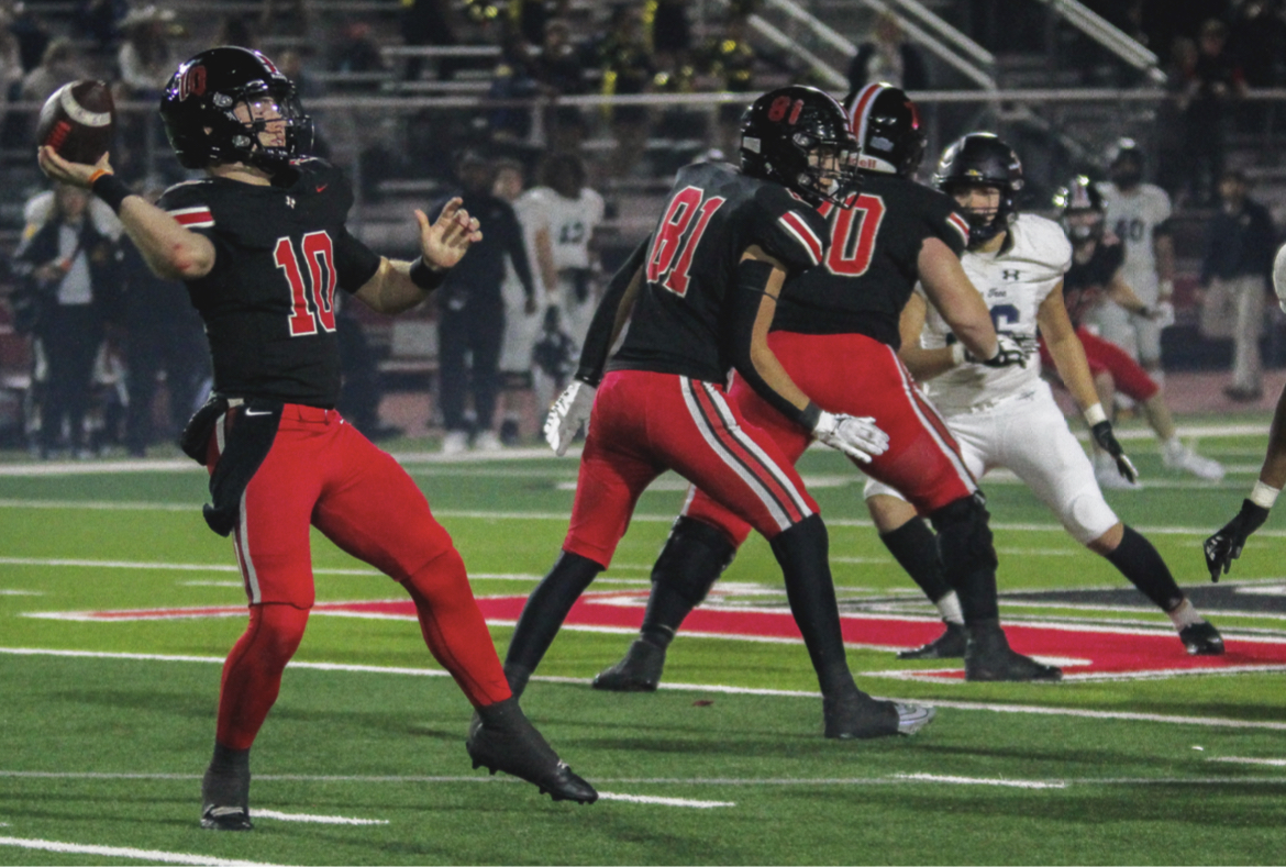 Senior quarterback no. 10 Alexander Franklin prepares to throw a pass in the lovejoy vs Pine Tree playoff game. The team won 43 - 6.