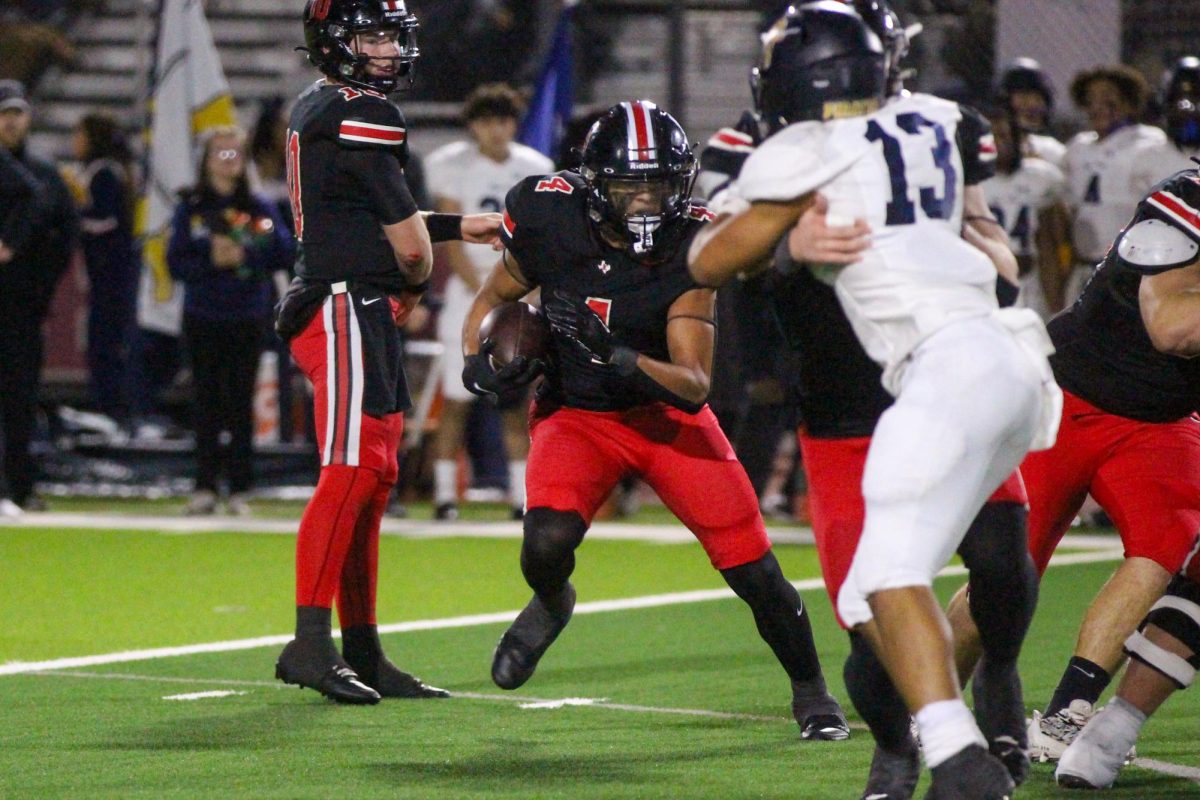 Senior running back no. 4 Dante Dean runs the ball. Dean ran for 73 total yards throughout the game and had one touchdown.