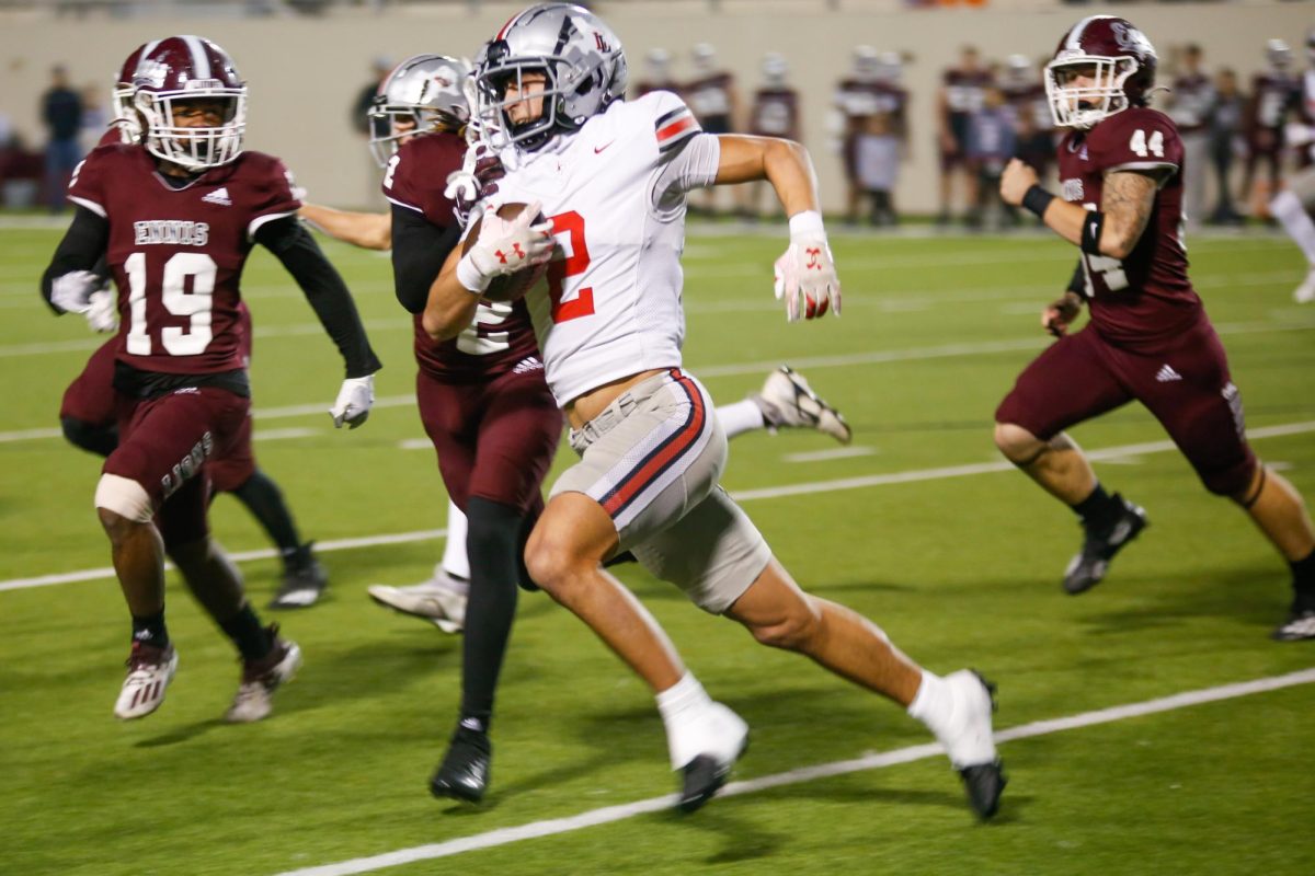 Junior safety no. 2 RJ McIntosh returns an Ennis punt. Lovejoy plays in the third round of the playoffs on Friday.