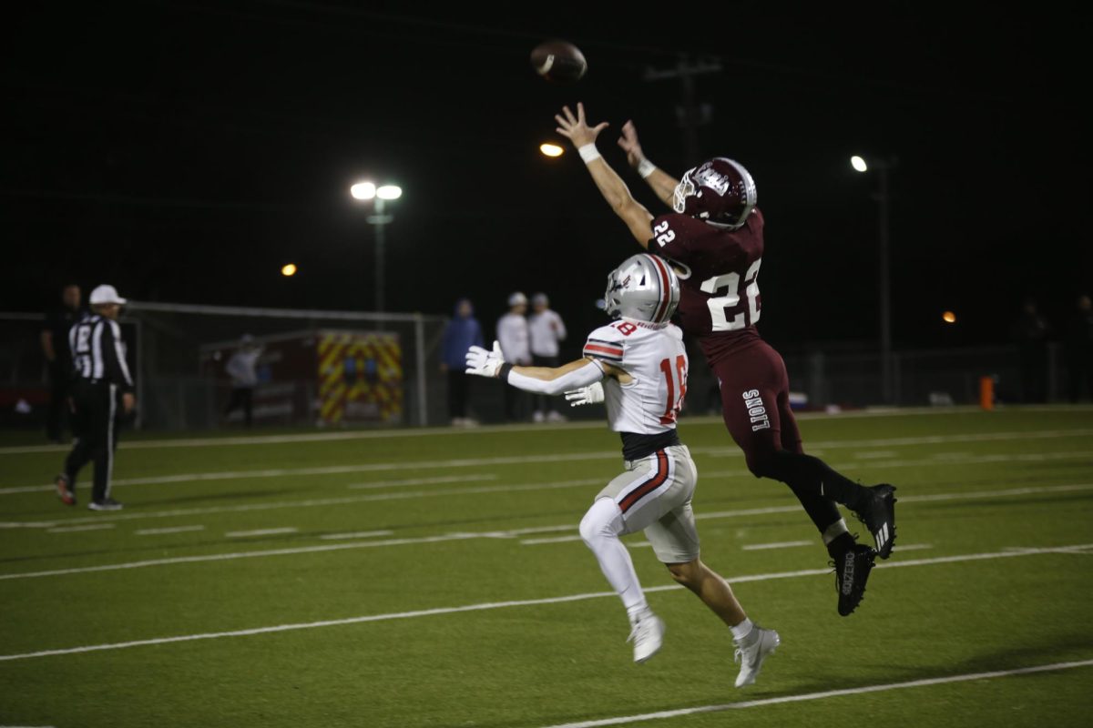 The Ennis defense intercepts a ball intended for no. 18 Ethan Nelson. The Lovejoy defense held Ennis to seven points.