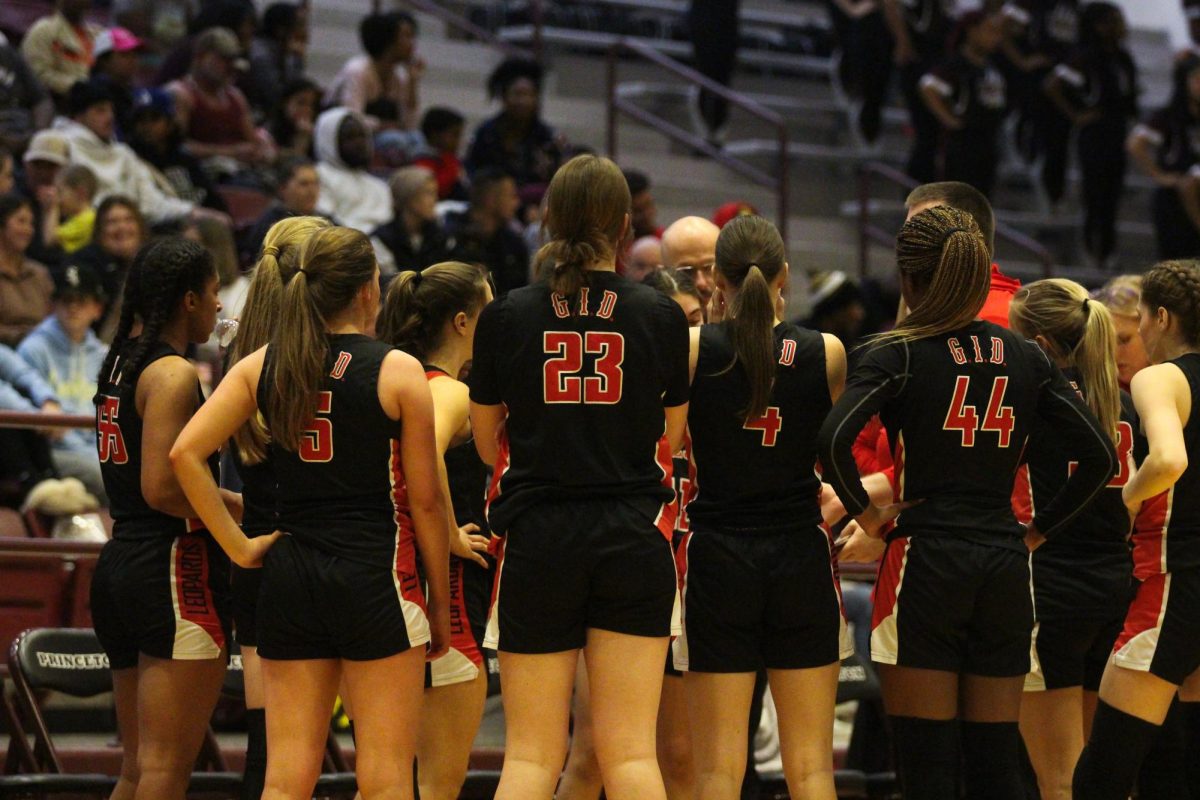 The girls team gets in a huddle during a timeout. The team will played Mckinney North last night.